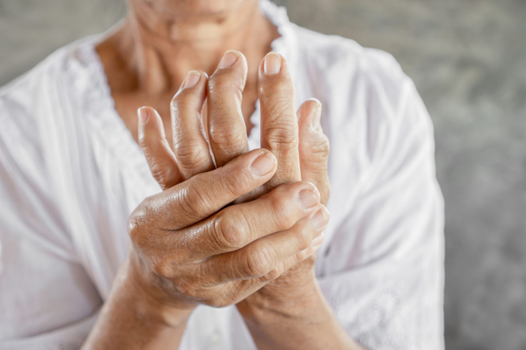 old woman suffering from arthritis
