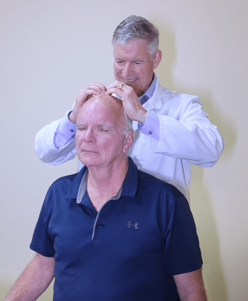 Dr. Timothy Douglass attend patients headache ytreatment